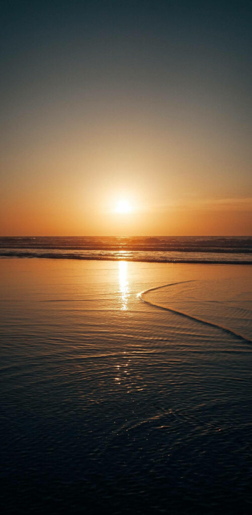 Capturing Nature's Serenity: iPhone 12 Pro's Breathtaking Sunset Reflection on Tranquil Waters Wallpaper