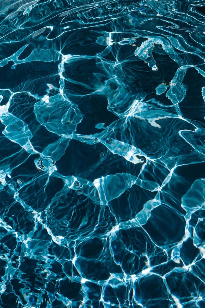 Tranquil Rippling Water Wallpaper with Light Reflections