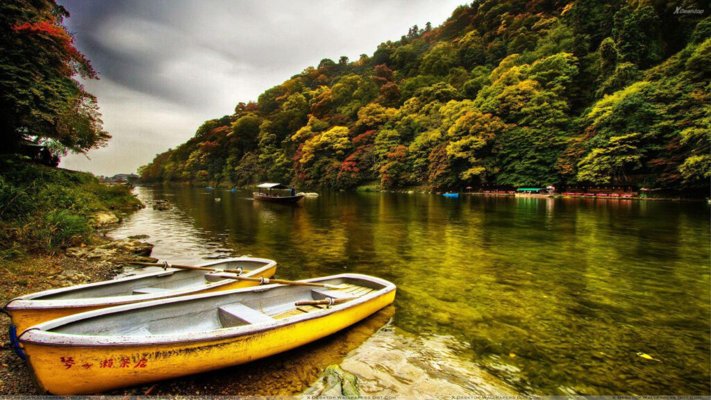 Tranquil River View Wallpaper: Lush Trees & Peaceful Boats