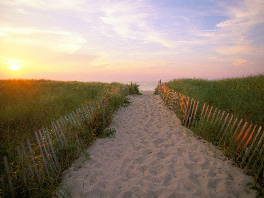 Tranquil Sandy Path to Ocean at Sunset – Serene Background Wallpaper