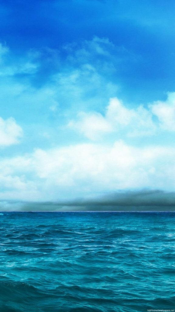 Seaside Serenity: A Mesmerizing Blue iPhone Background with Oceanic Splendor Wallpaper