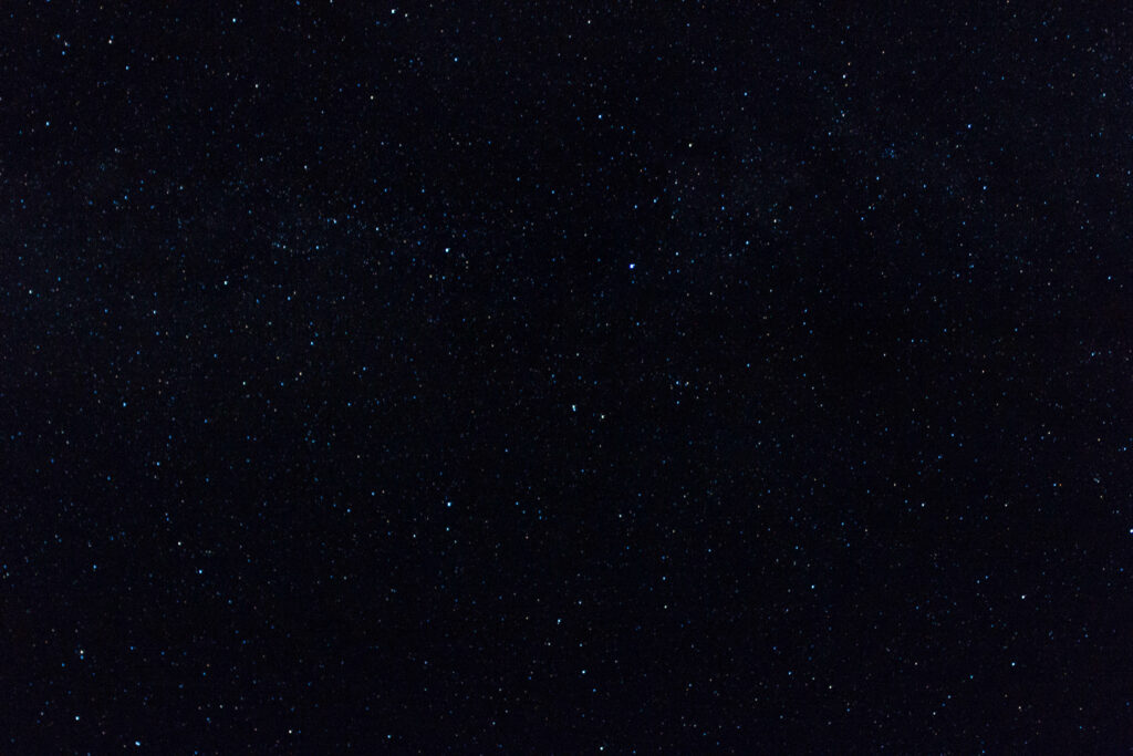 Tranquil Cosmic Wallpaper: Sparkling Stars on Dark Background