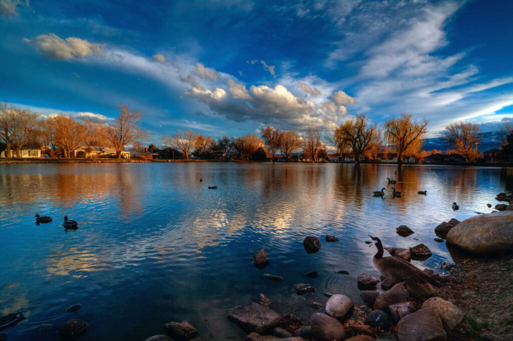 Tranquil Lake Reno Sunrise Wallpaper: Serene Nature Reflection