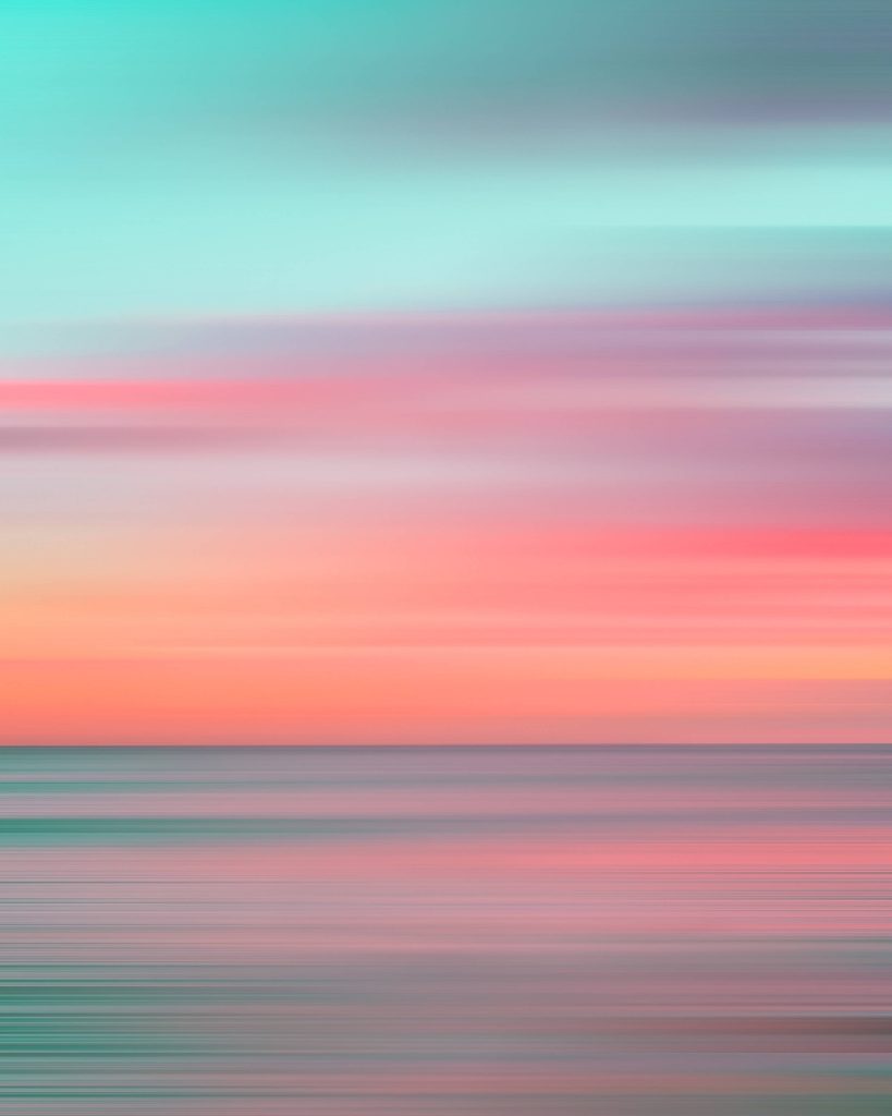 Abstract sky wallpaper with teal coral pink sunset gradient and horizontal motion blur streaks