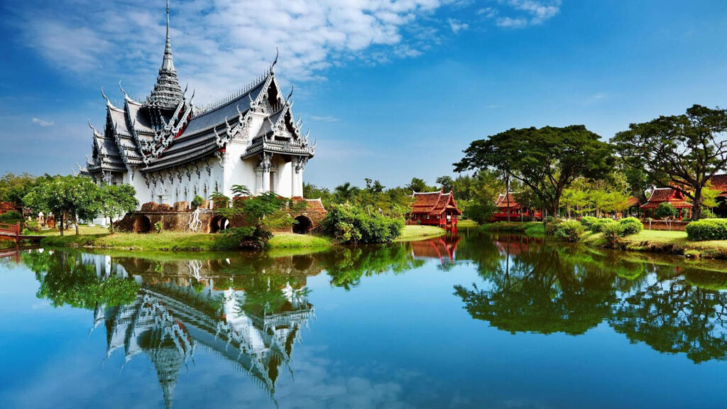 Serene White Temple Reflection in Calm Lake - Tranquil Wallpaper