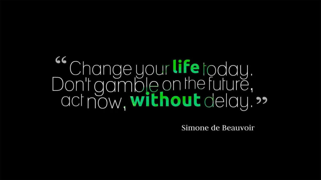 Seize the Moment: Empowering Motivational Quotes by Simone De Beauvoir to Transform Your Life Wallpaper