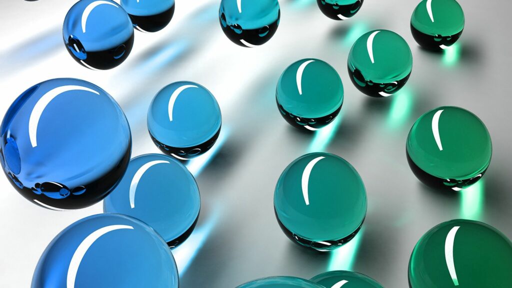 Translucent Blue & Green Glass Balls in Minimalist Space Background Wallpaper