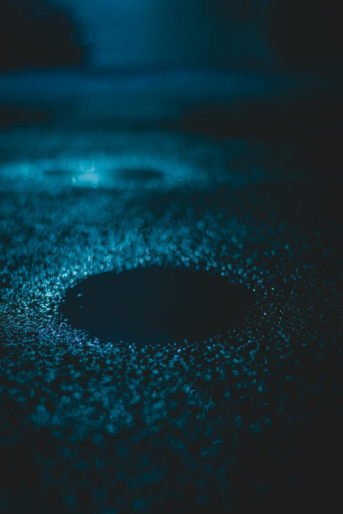 Mesmerizing Neon Glow: Captivating Reflection in Cool Blue Puddle Wallpaper