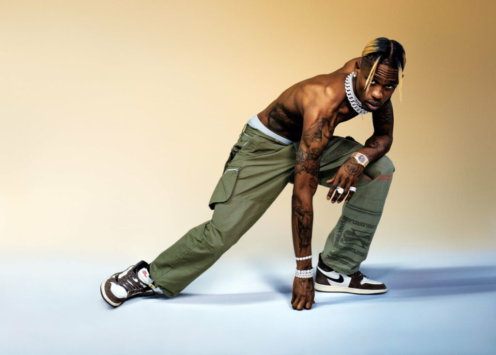 Mesmerizing Melodies: Travis Scott Takes Center Stage in Captivating HD Wallpaper