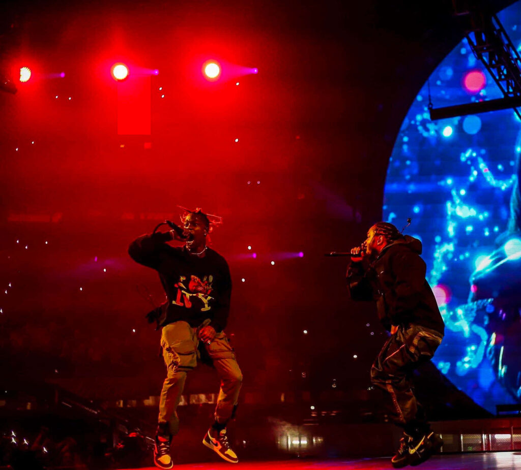 Vibrant Travis Scott & Kendrick Lamar Concert Wallpaper Background