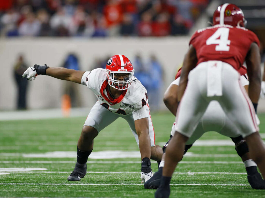 Travon Walker defensive stance vs Alabama Crimson Tide intense college football game wallpaper