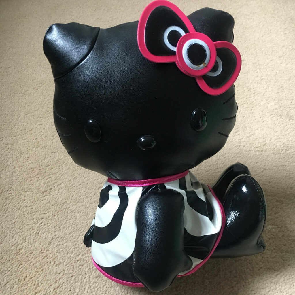 Trendy Black Hello Kitty Toy with Pink Bow for Halloween Decor Wallpaper