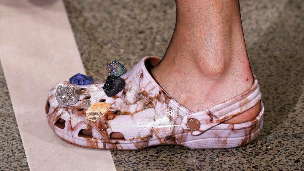 Close-up of stylish pink marble Crocs with colorful glossy gems trendy creative footwear design Wallpaper