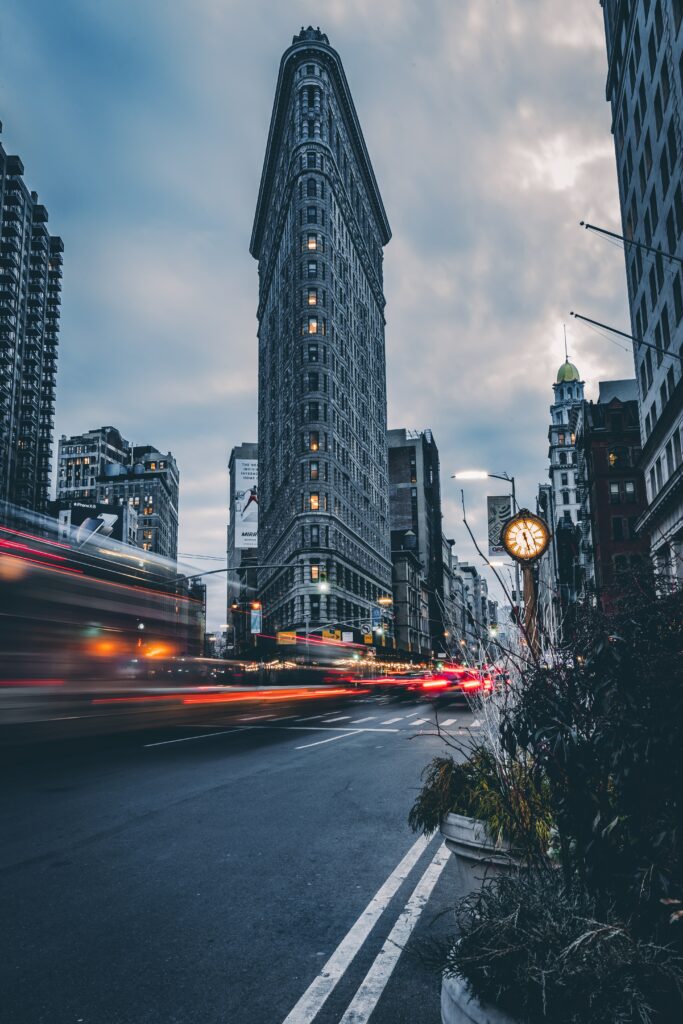 Moody Urban Wallpaper: Iconic Triangular Building & Dynamic Lights