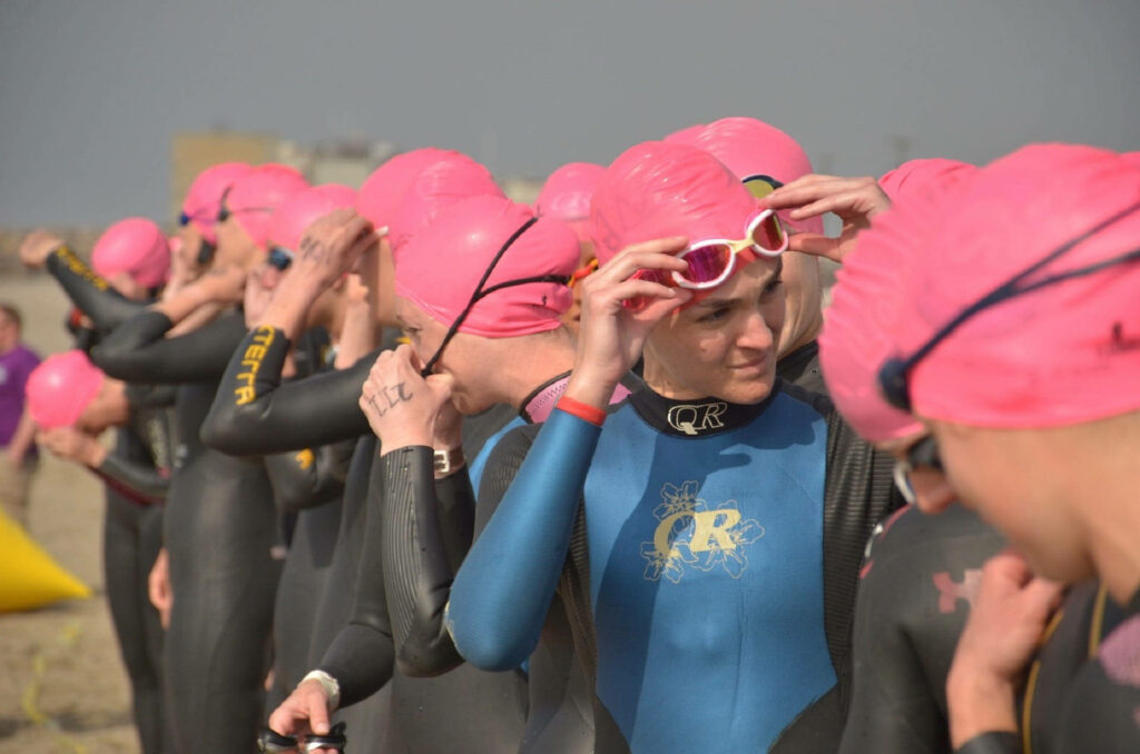Empowered Female Athletes: Triathlon Swimming Phase Wallpaper