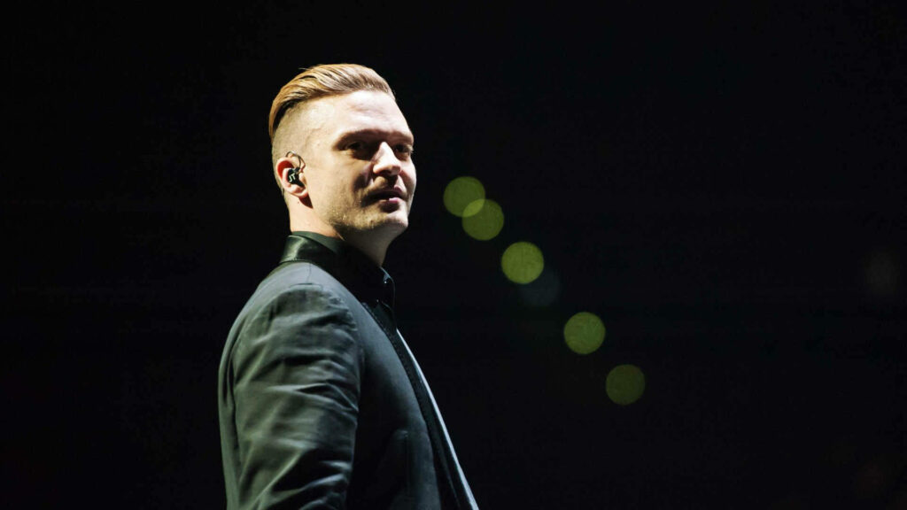 Charismatic Justin Timberlake Wallpaper: Energetic Stage Performance