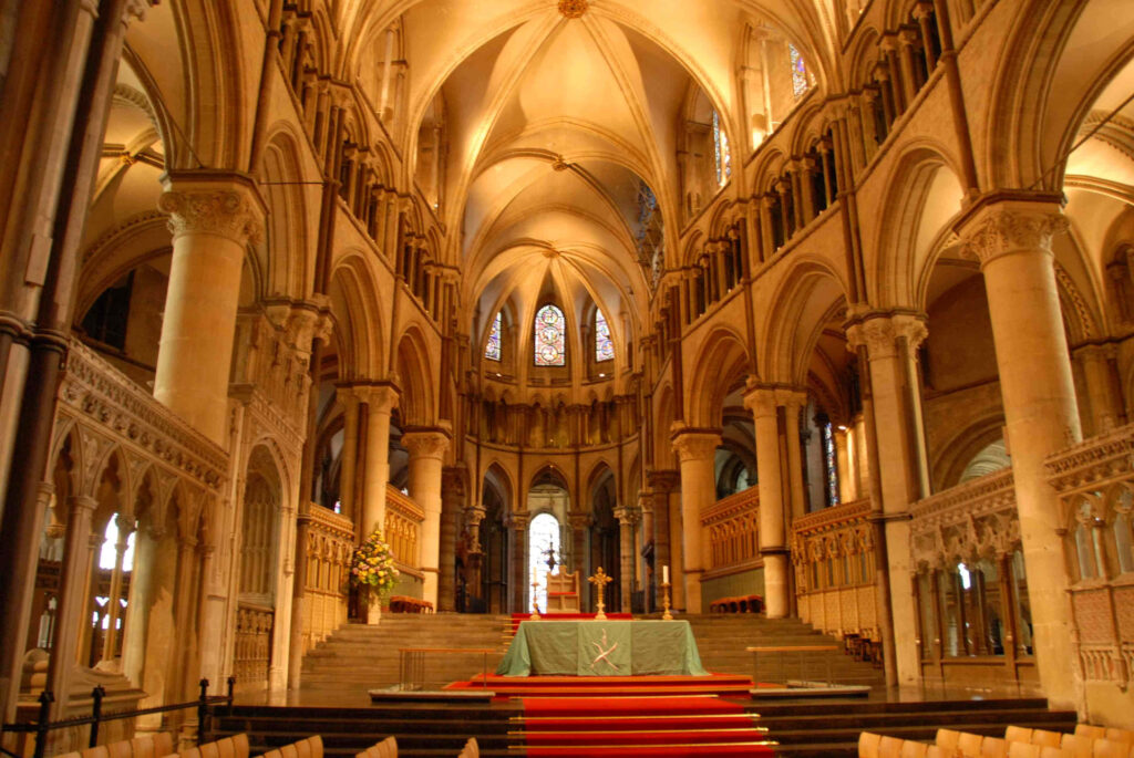 Trinity Chapel interior Canterbury Cathedral with Gothic arches stained glass and golden stonework Wallpaper
