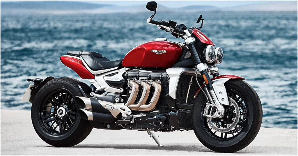 Triumph Motorcycle Wallpaper: Bold Adventure by Serene Waterfront