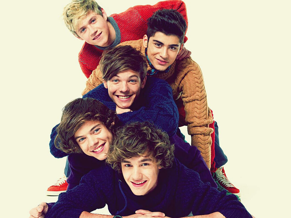 Triumphant One Direction: Fierce Smiles of a Victorious Boy Band Wallpaper