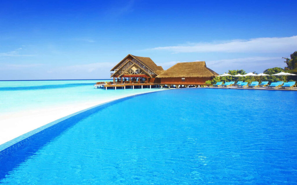 Stunning Beach Paradise Wallpaper with Infinity Pool & Bungalow Retreat