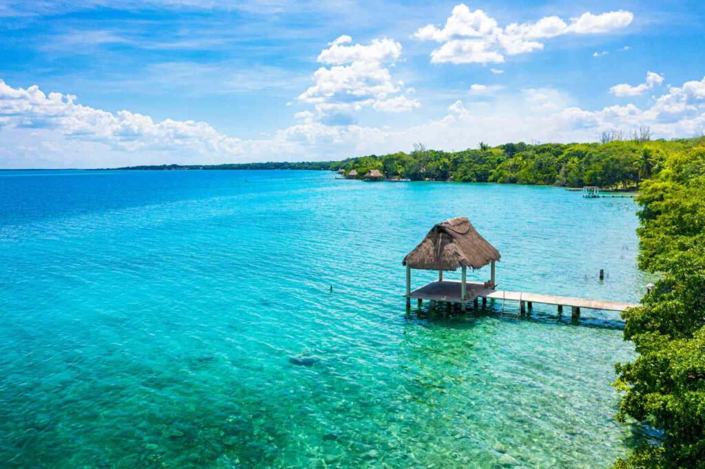 Stunning Tropical Beach Wallpaper: Turquoise Waters & Serene Pier