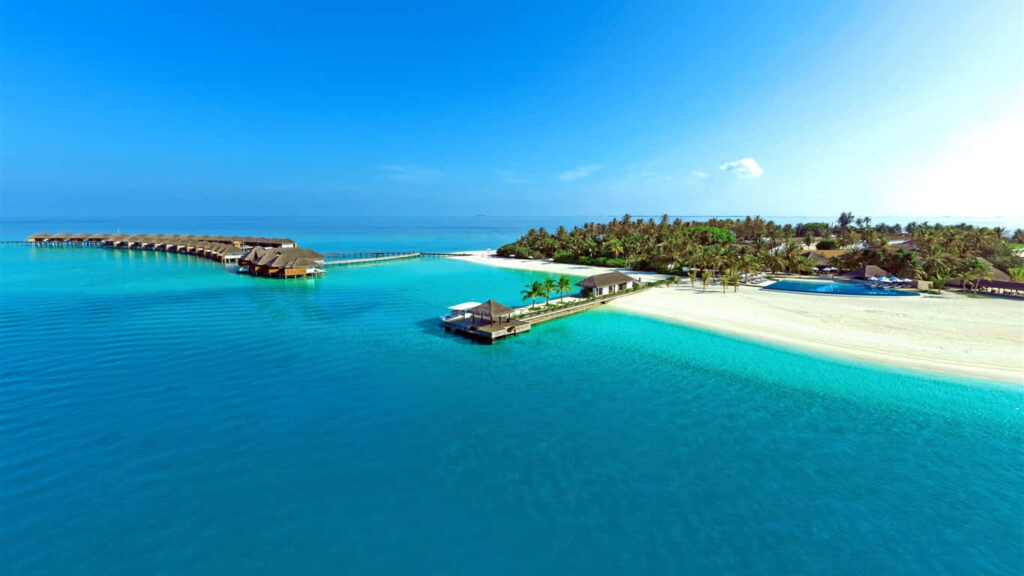 Serene Tropical Beach: Crystal-Clear Waters & White Sandy Shores Wallpaper