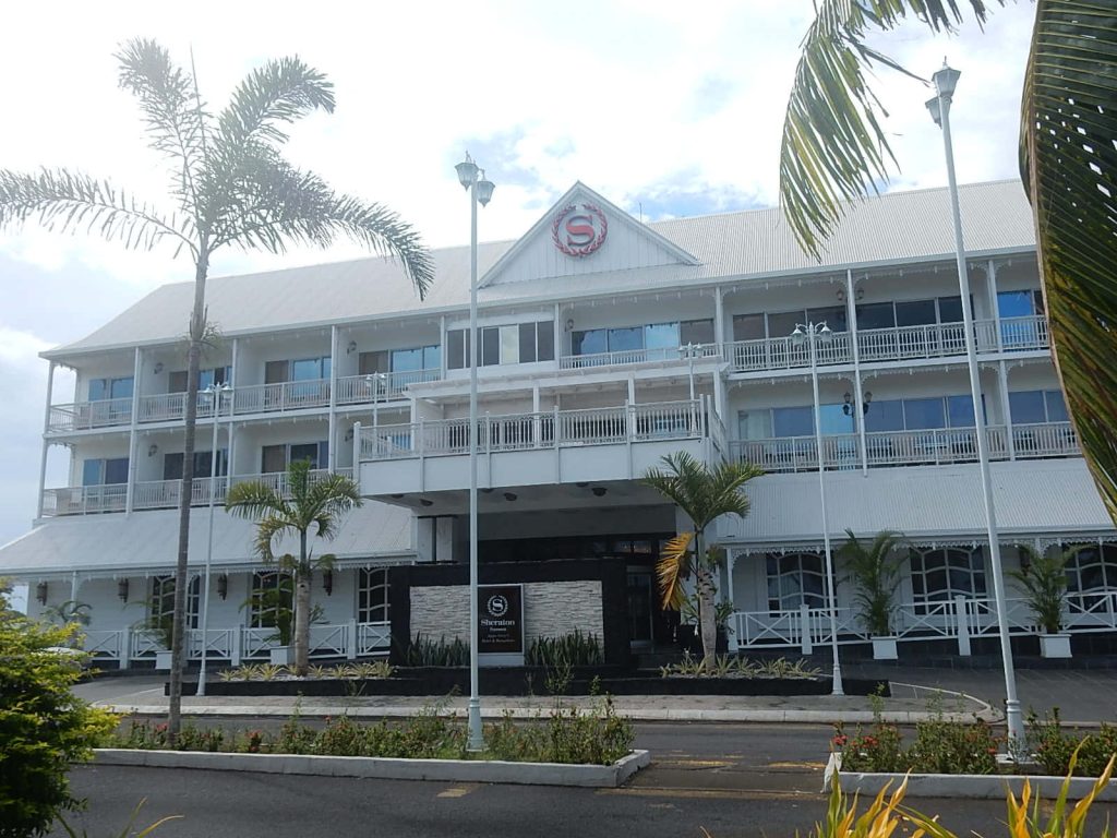 Sheraton Samoa Aggie Grey's Hotel colonial architecture with palm trees in Apia tropical daylight Wallpaper