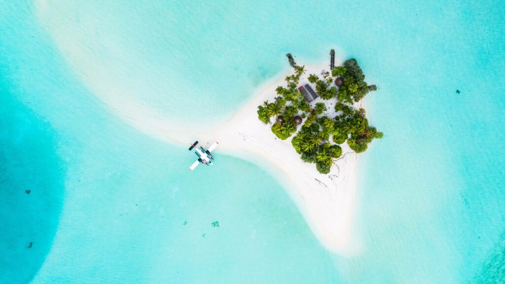 Secluded Island Paradise: Bird's-Eye View with Turquoise Waters Wallpaper