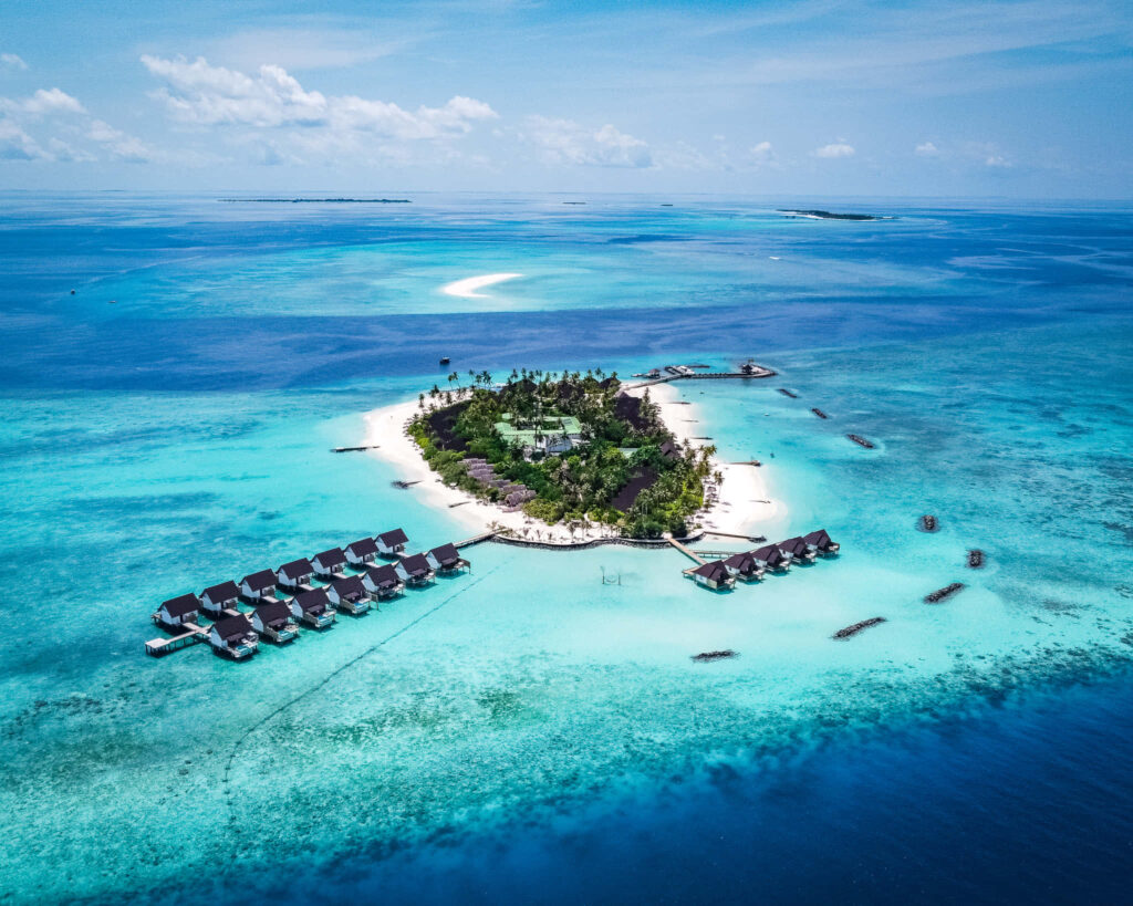 Tropical Maldives Aerial View: Overwater Villas & Turquoise Waters Wallpaper
