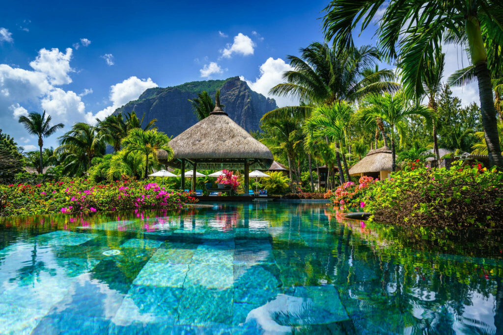 Exotic Paradise: A Captivating Oasis in Mauritius, Featuring a Check-Patterned Pool and a Charming Nipa Hut Cottage Wallpaper