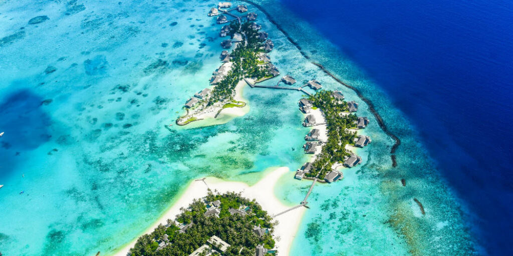 Stunning Aerial View of Tropical Paradise with Turquoise Waters Wallpaper