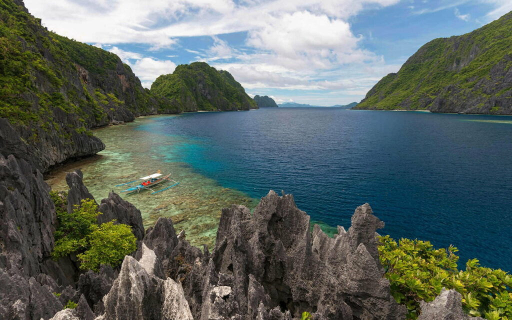 Paradise Pier: A Captivating Snapshot of Palawan's Serene Oasis amidst Azure Waters Wallpaper