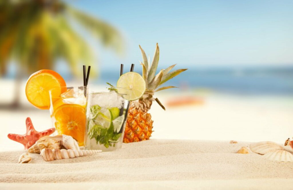 Refreshing Tropical Paradise: Captivating Summer Beach Scene with Pristine Sand, Vibrant Cocktails, Exotic Shells, and Breathtaking HD Wallpaper Background