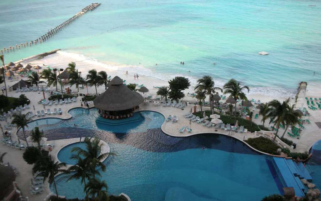 Tropical Beachfront Wallpaper: Luxurious Resort & Turquoise Waters