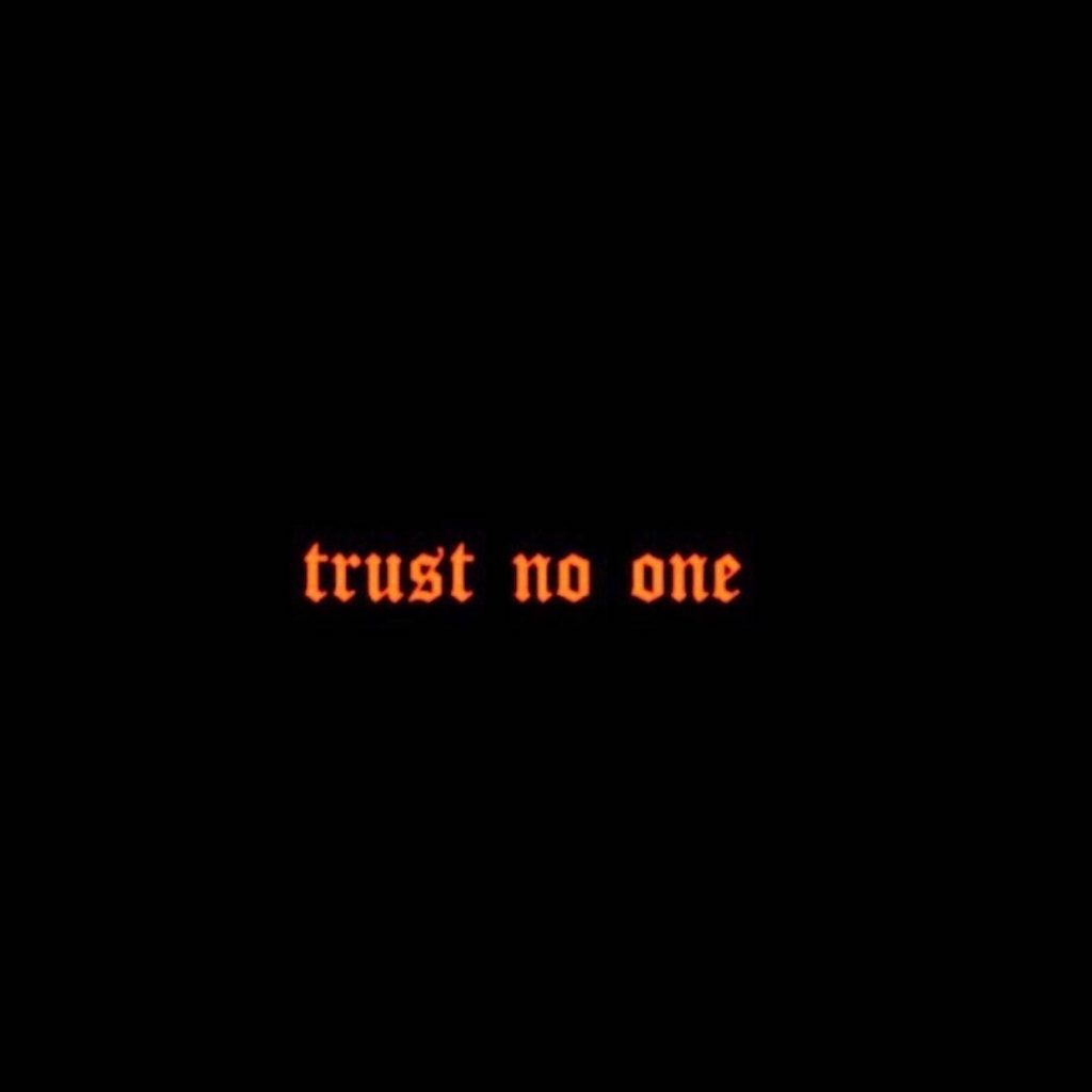 Minimalist black wallpaper with sharp red gothic trust no one text moody dark edgy aesthetic