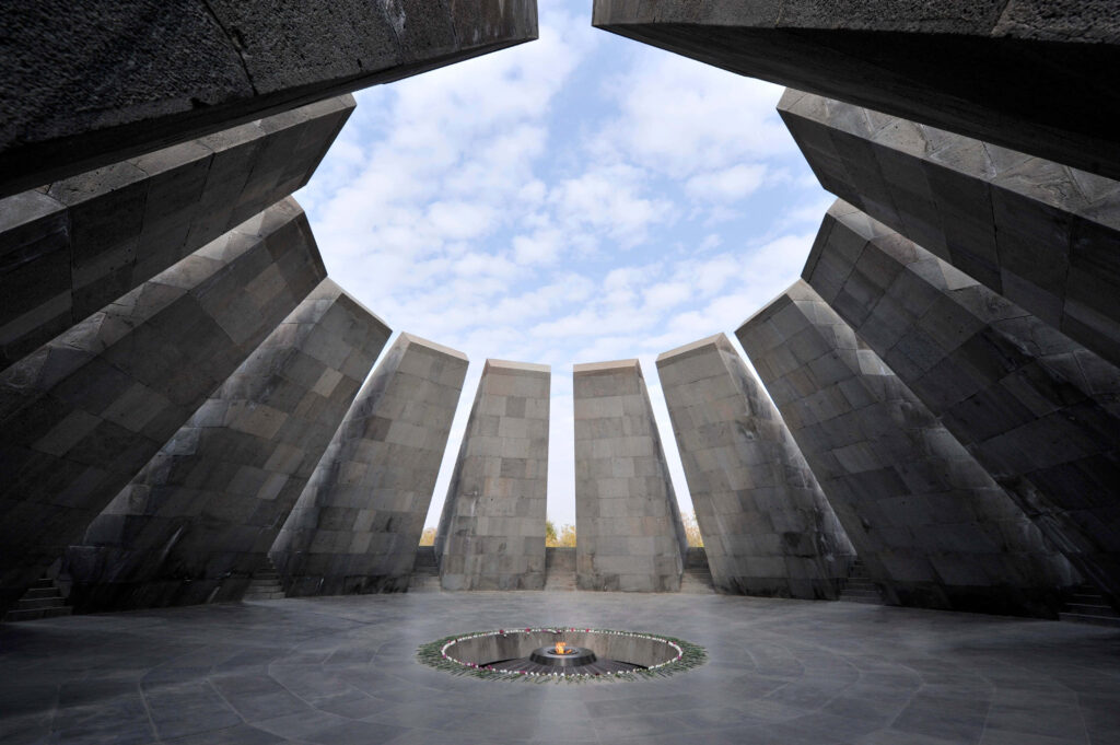 Tsitsernakaberd Armenian Genocide Memorial stone pillars surrounding eternal flame wallpaper