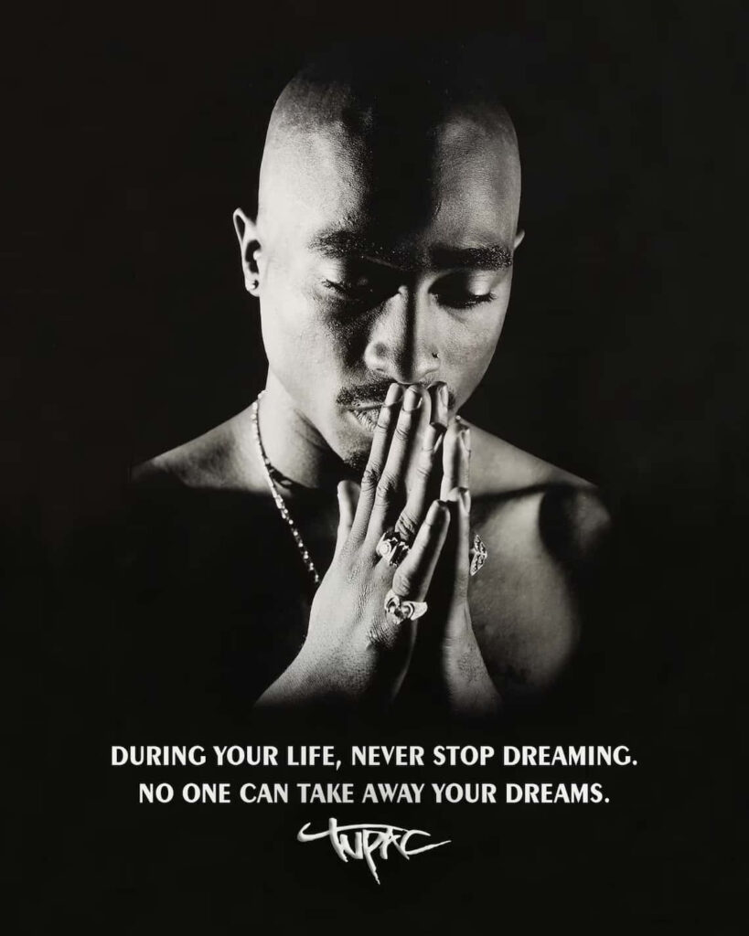 Tupac Unleashed: Immortalizing Hip-Hop's Icon in the Lively Streets of NYC Wallpaper
