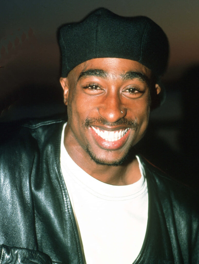 The Unstoppable Force: Tupac Shakur Captivates a Sea of Devoted Fans in This Iconic Snapshot Wallpaper