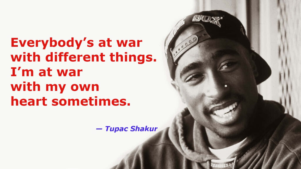 Intensity Illuminated: Tupac Shakur radiates power in illuminated football jersey Wallpaper