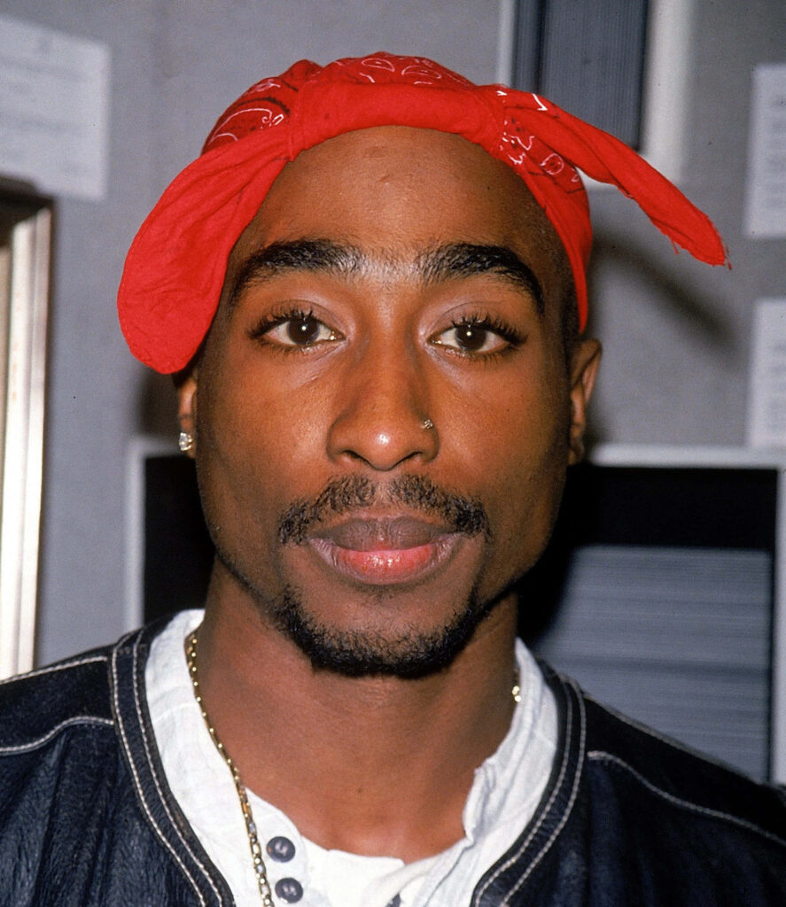 Courageous Icon: Tupac's Empowering Presence Echoes Through Time Wallpaper