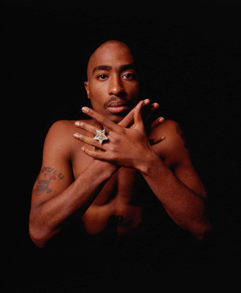 The Gilded Legacy: A Hip-Hop King's Enduring Stature Resurrected in Ancient Coin Wallpaper