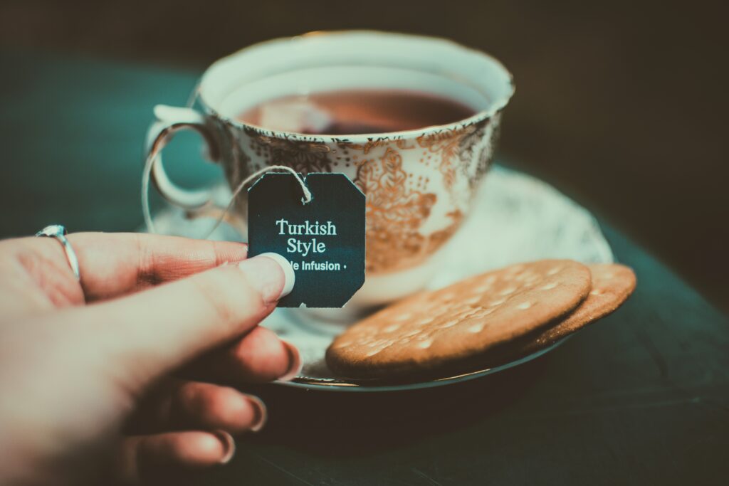 Turkish Tea Infusion: Captivating Image with Biscuits & Wallpaper