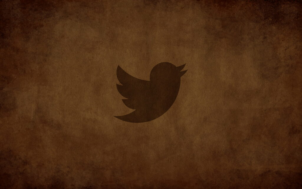 Digital Paradise: Vibrant Twitter Bird Soars Amidst Captivating Bird-Themed QHD Wallpaper
