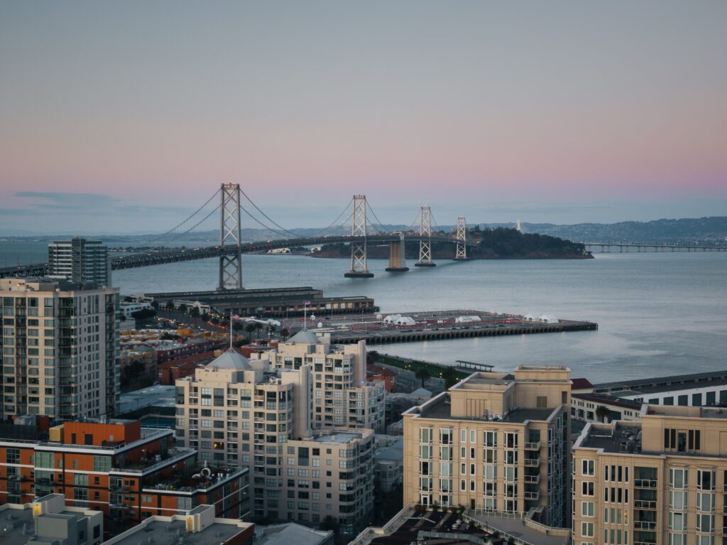 Twilight City Aerial Wallpaper: Serene Urban Scene with Bridge
