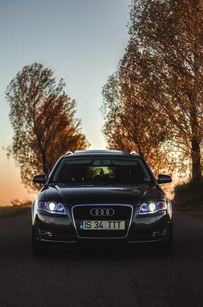 Elegant Audi Car Wallpaper with Twilight Sky and Trees
