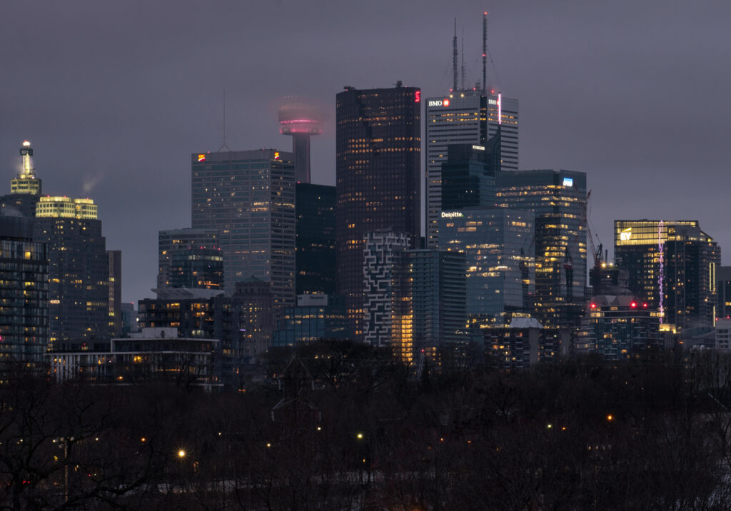 Twilight Cityscape Wallpaper: Illuminated Skyscrapers & Nature
