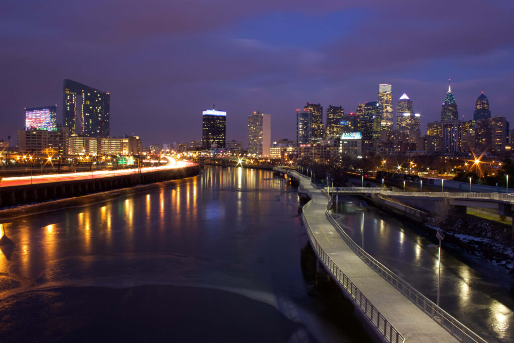 Twilight Philadelphia Skyline Wallpaper: Vibrant Purple Sky Reflections