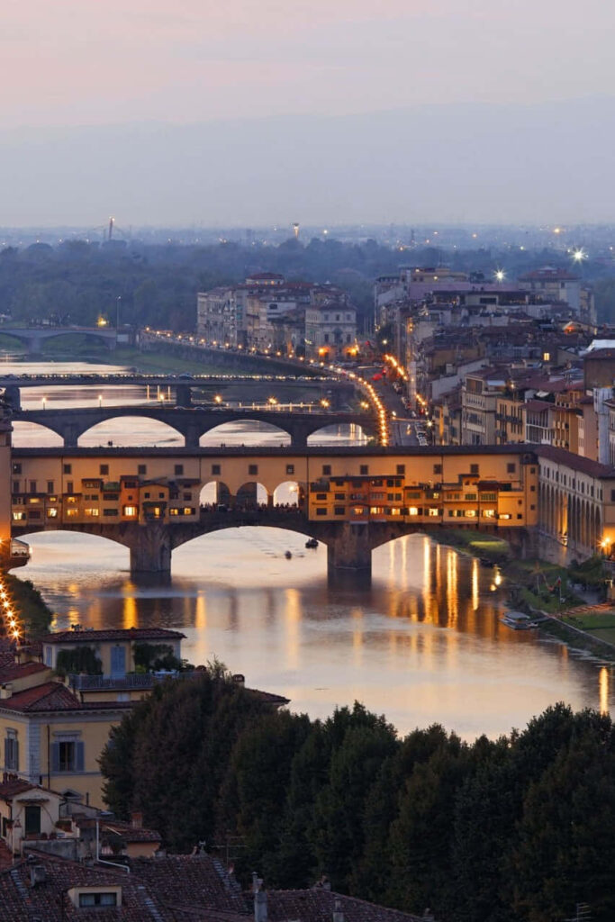 Twilight Ponte Vecchio Wallpaper: Illuminated Arches Over Arno River