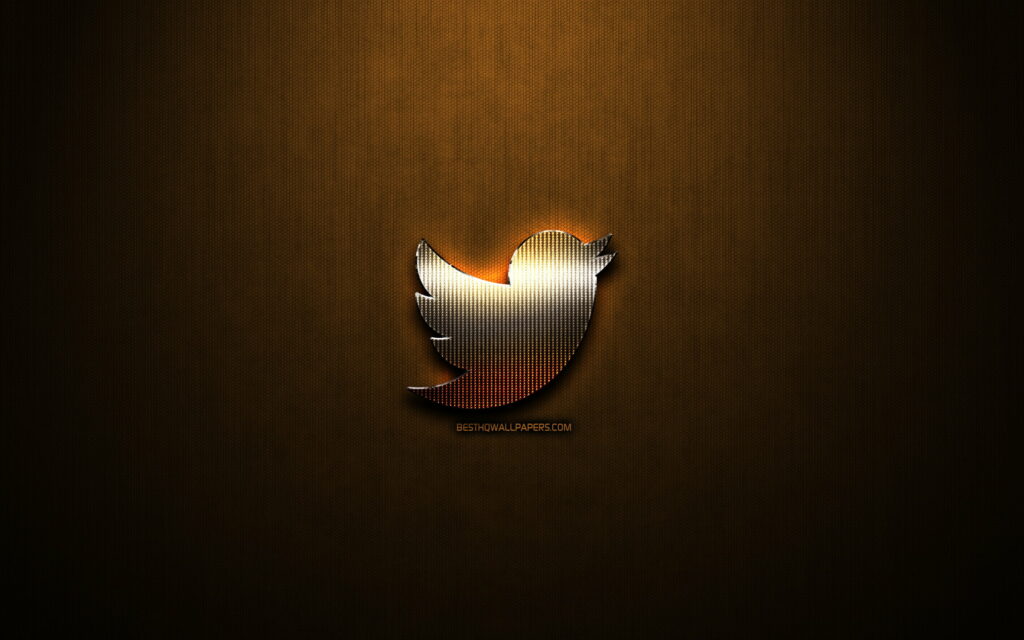 Glistening Twitter Logo Amidst Bronze Brilliance - A Captivating Brand Showcase in QHD Wallpaper