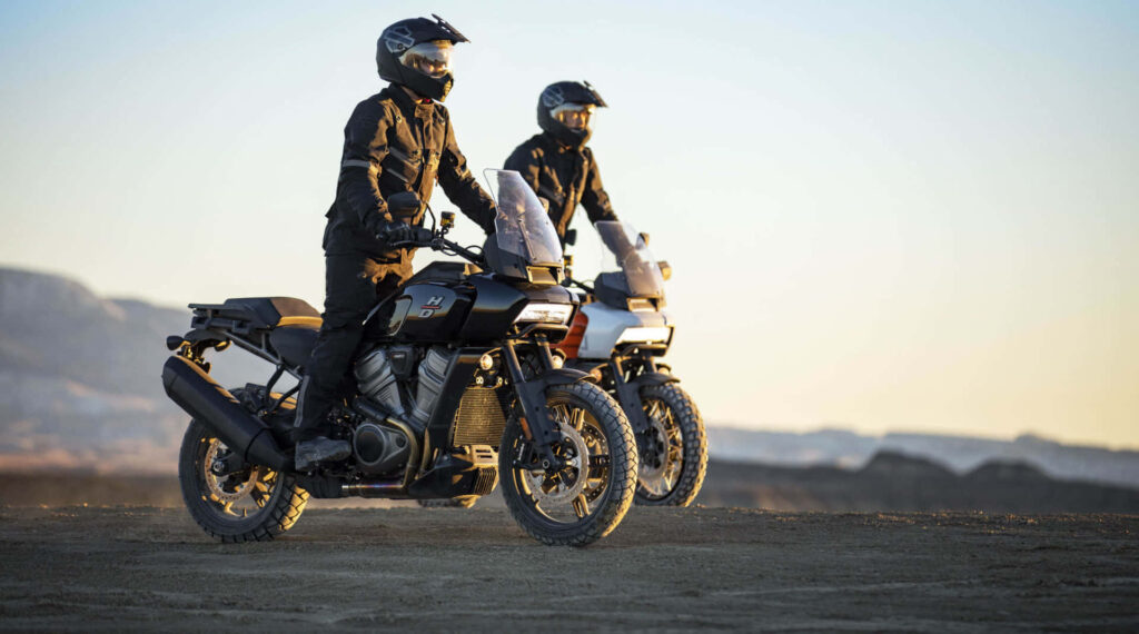 Adventurers Gear Up: Off-Road Motorcycle Journey at Sunset Wallpaper